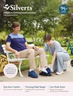 Silvert’s Catalog: A smiling senior woman wearing a stylish blue adaptive cardigan with easy-touch closures.